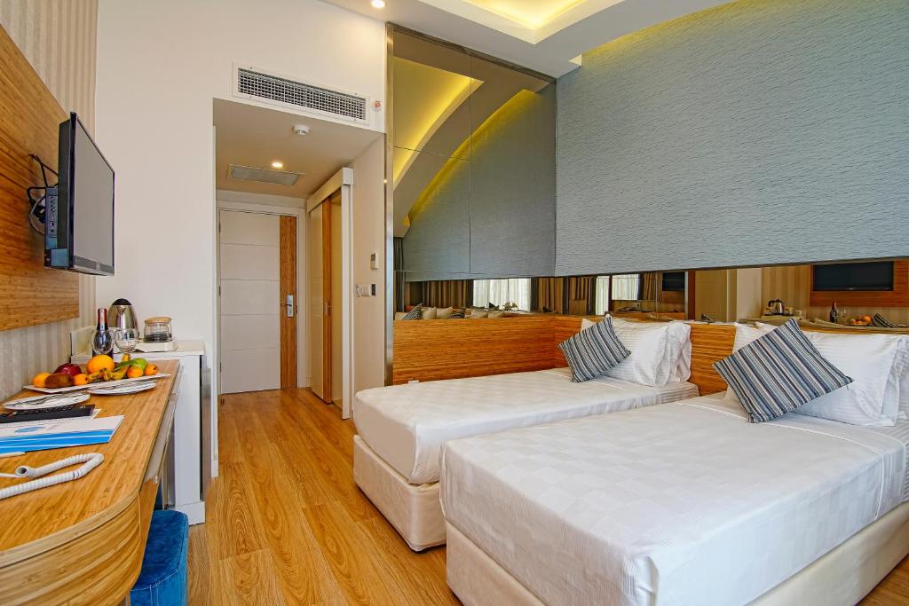 Mūsdienīgs numurs ar divām atsevišķām gultām Dosinia Luxury Resort.