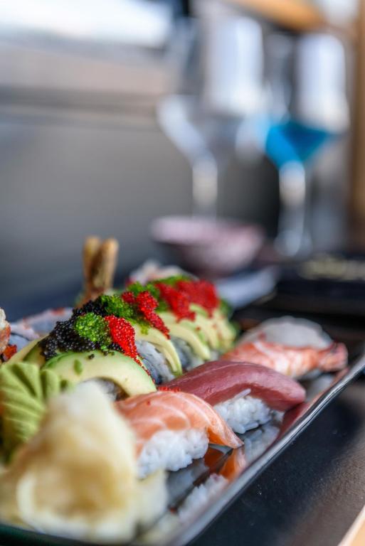 Sushi plate with colorful rolls and garnishes at Royal Marmin Bay Boutique & Art Hotel