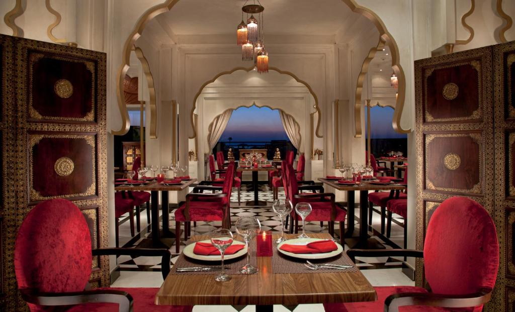 Elegant dining area at Sunrise Crystal Bay Resort with red decor and stunning views.