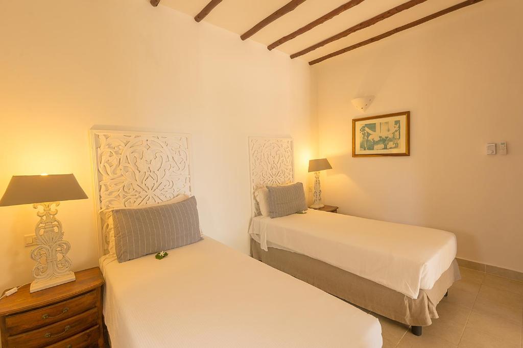 Divvietīgs numurs Konokono Beach Resort ar ērtām gultām.