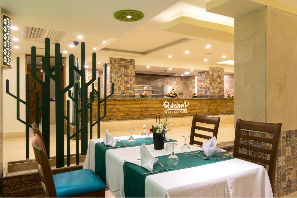 Elegant dining setup at Gravity Hotel Sahl Hasheesh's Qdoba Mexican Grill.