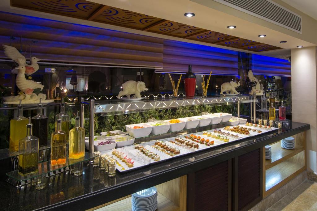 Buffet spread at Gravity Hotel Sahl Hasheesh with appetizers and decorative elements.