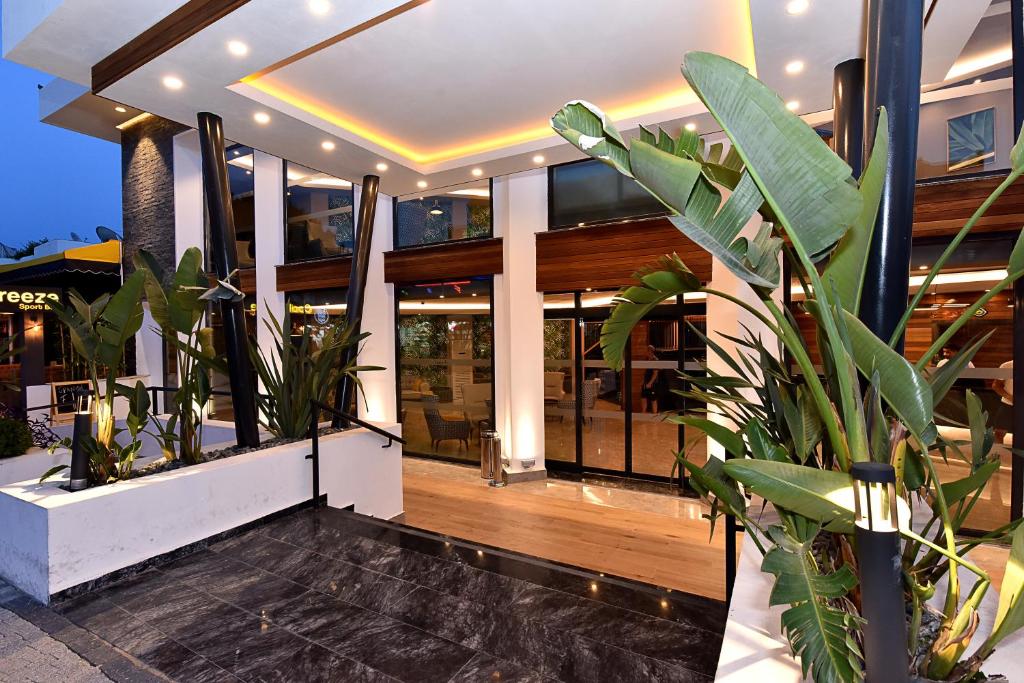 Parkım Ayaz Hotel elegant entrance with modern design and lush greenery.