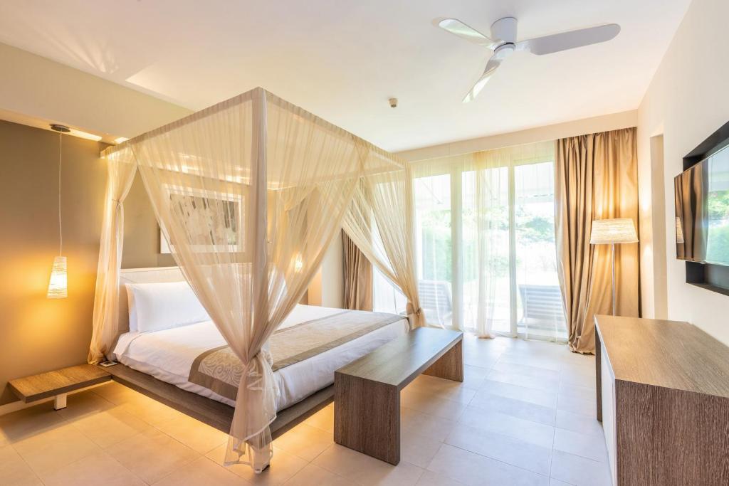 Plašs numurs ar baldahīna gultu viesnīcā RIU Palace Zanzibar