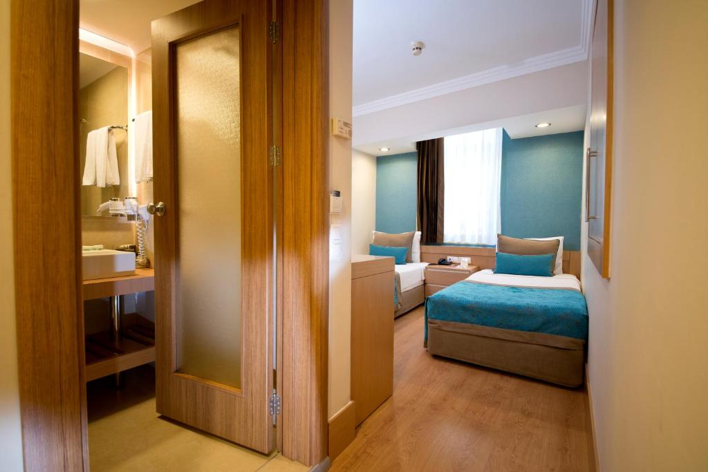 Limak Limra Hotel & Resort moderns numurs ar divām gultām un vannas istabu