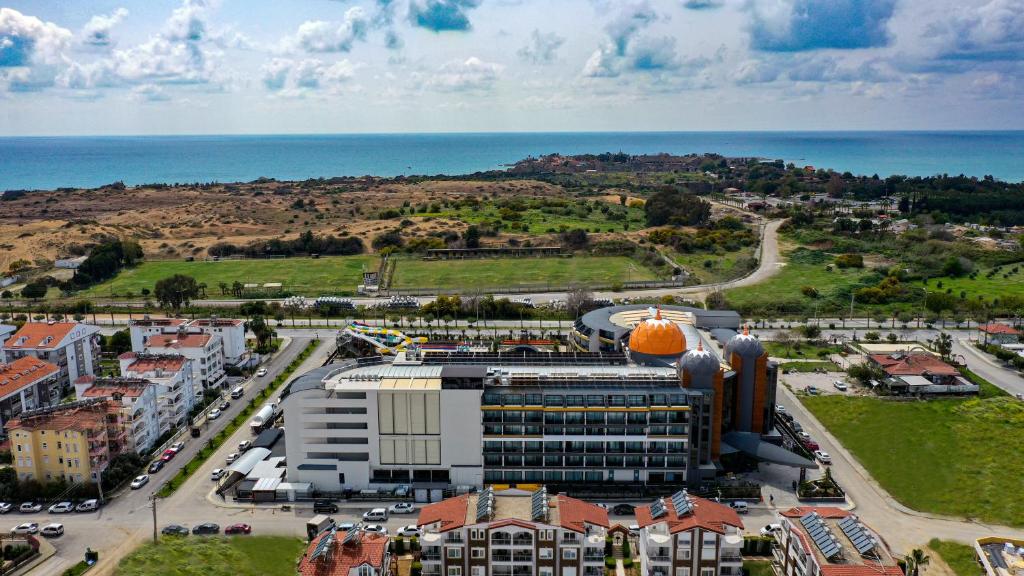 Aerial view of Arnor De Luxe Hotel & Spa near the coast.