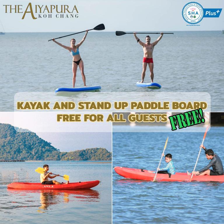 Divi cilvēki stāv uz SUP dēļiem The Aiyapura Koh Chang piekrastē.