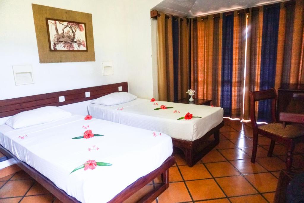 Numurs ar divām gultām viesnīcā Club Bentota.