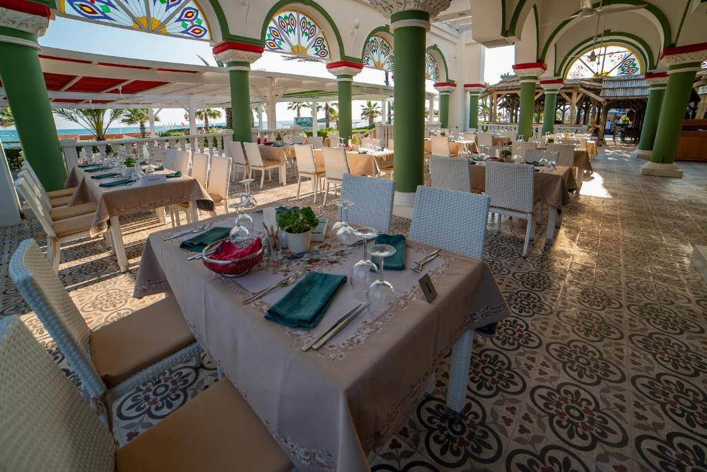 Elegant dining area at Sentido Kamelya Selin Luxury Resort & SPA with sea view.