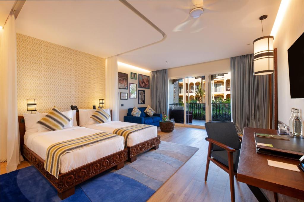 Divvietīgs numurs viesnīcā The Mora Zanzibar ar balkonu.