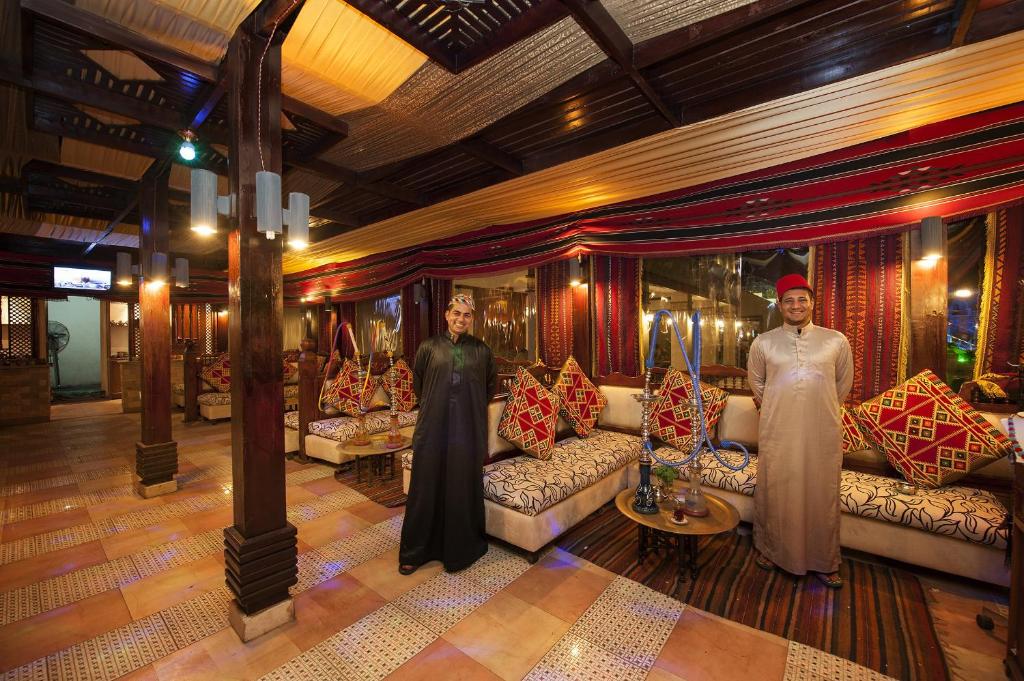 Elegant lounge area at Sunrise Arabian Beach Resort with welcoming staff.