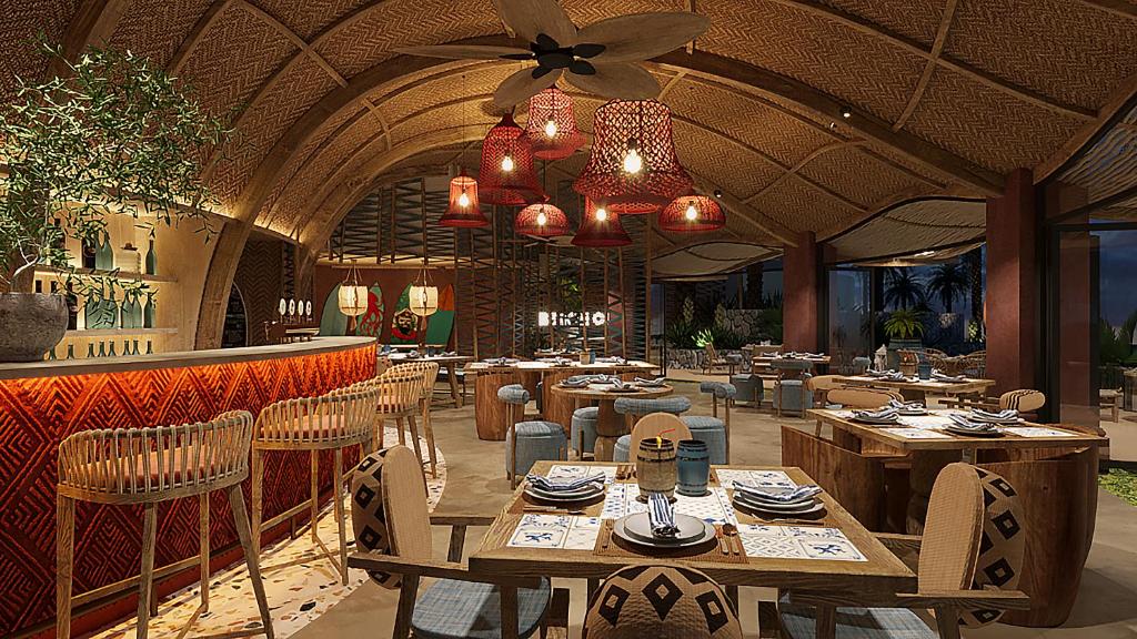 Dizainveikals ar modernu interjeru, kas apvieno dabīgas materiālus un siltas krāsas. Gaismas ķermeņi un ēdamgaldi rada patīkamu atmosfēru.