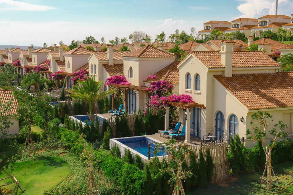 Centara Mirage Resort Mui Ne villas with lush gardens and pools.