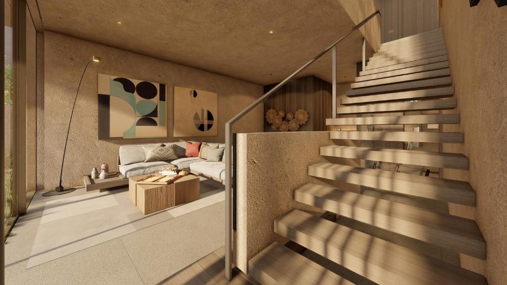 Mūsdienīga viesnīcas numura interjers Lujo Hotel Bodrum ar ērtu dīvānu un kāpnēm.