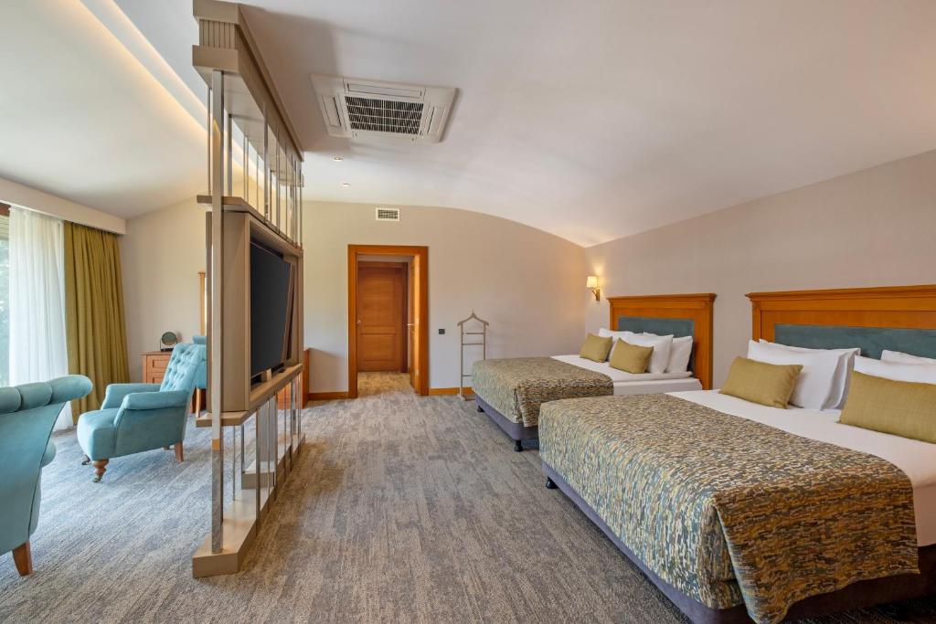 Moderns numurs ar divām gultām Limak Limra Hotel & Resort.