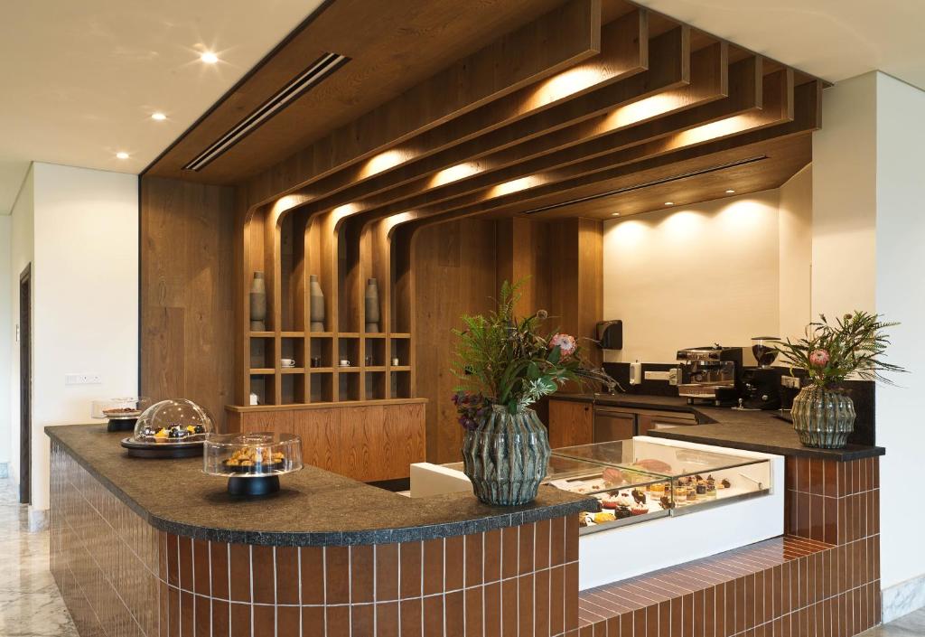 The GrandResort Limassol Cyprus elegant cafe interior with pastries.