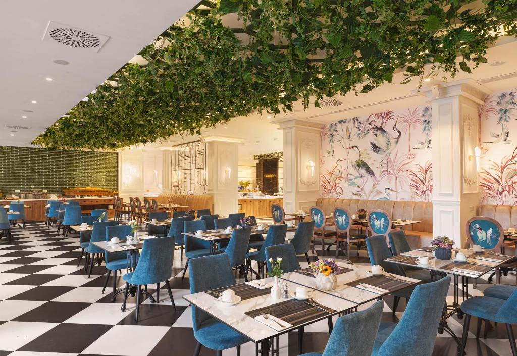 The GrandResort Limassol Cyprus elegant restaurant interior with vibrant decor.