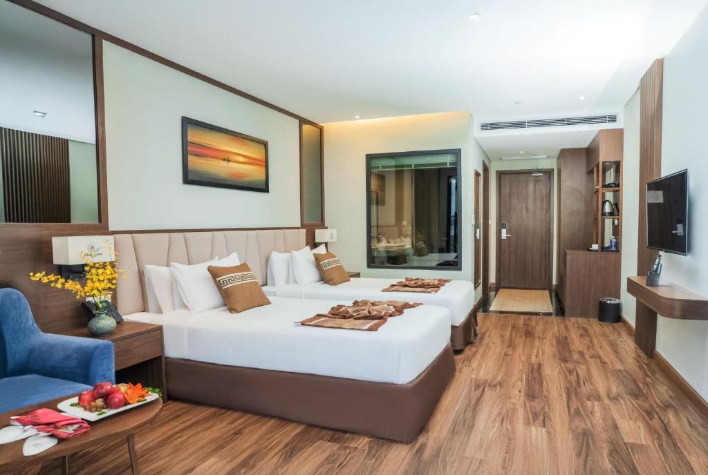 Elegants numurs Vipol Muine Hotel & Spa ar divām gultām.