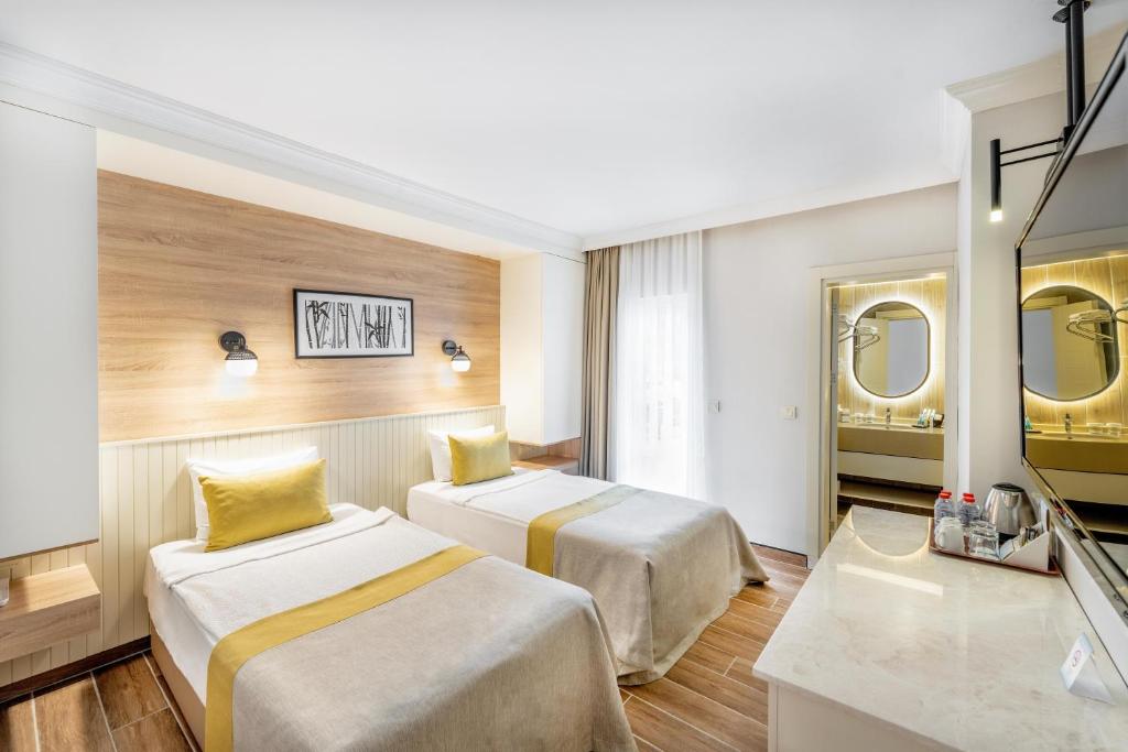 Divvietīgs numurs ar divām gultām un moderno dizainu, Club Marco Polo