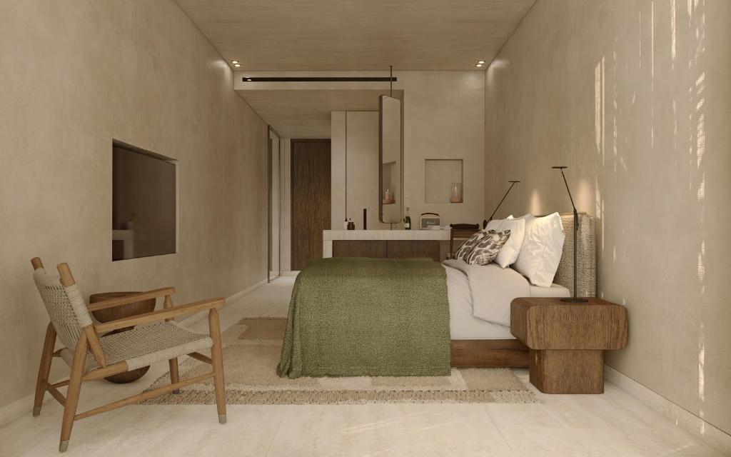 Moderns numurs ar gultu un ērtiem krēsliem hotelī OKU Bodrum.