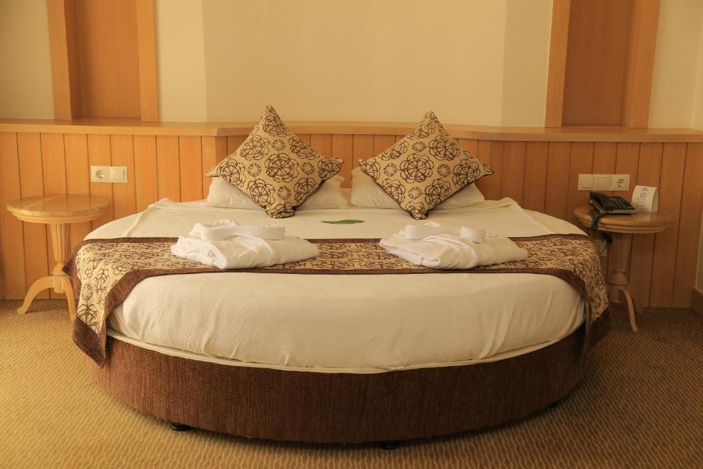Saphir Resort & Spa numurs ar ērtu gultu un mājīgu interjeru.