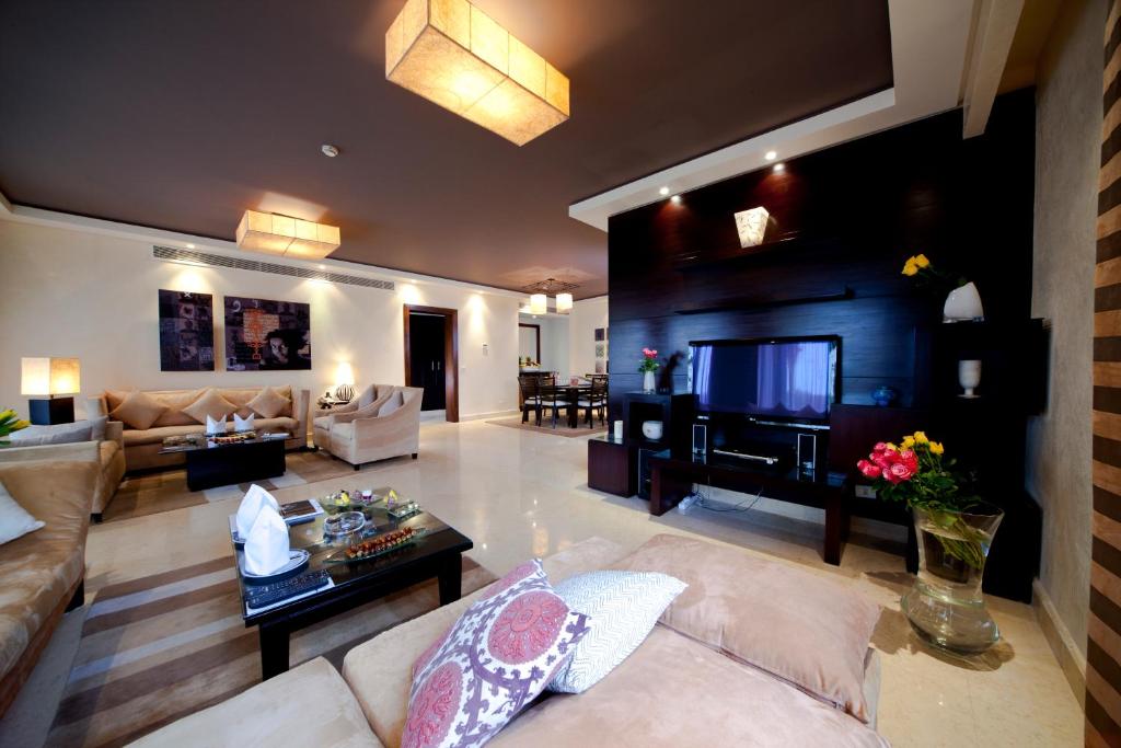 Elegant living room at Grand Rotana Resort & Spa with modern decor and cozy seating.