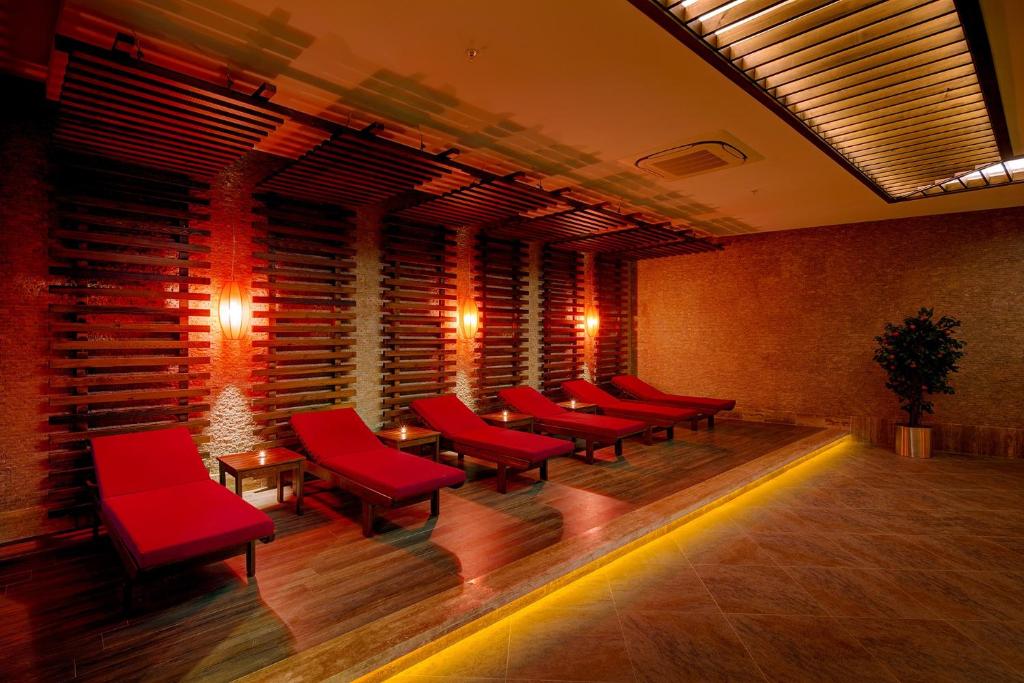 Spa at Magic Life Jacaranda with relaxing red loungers.