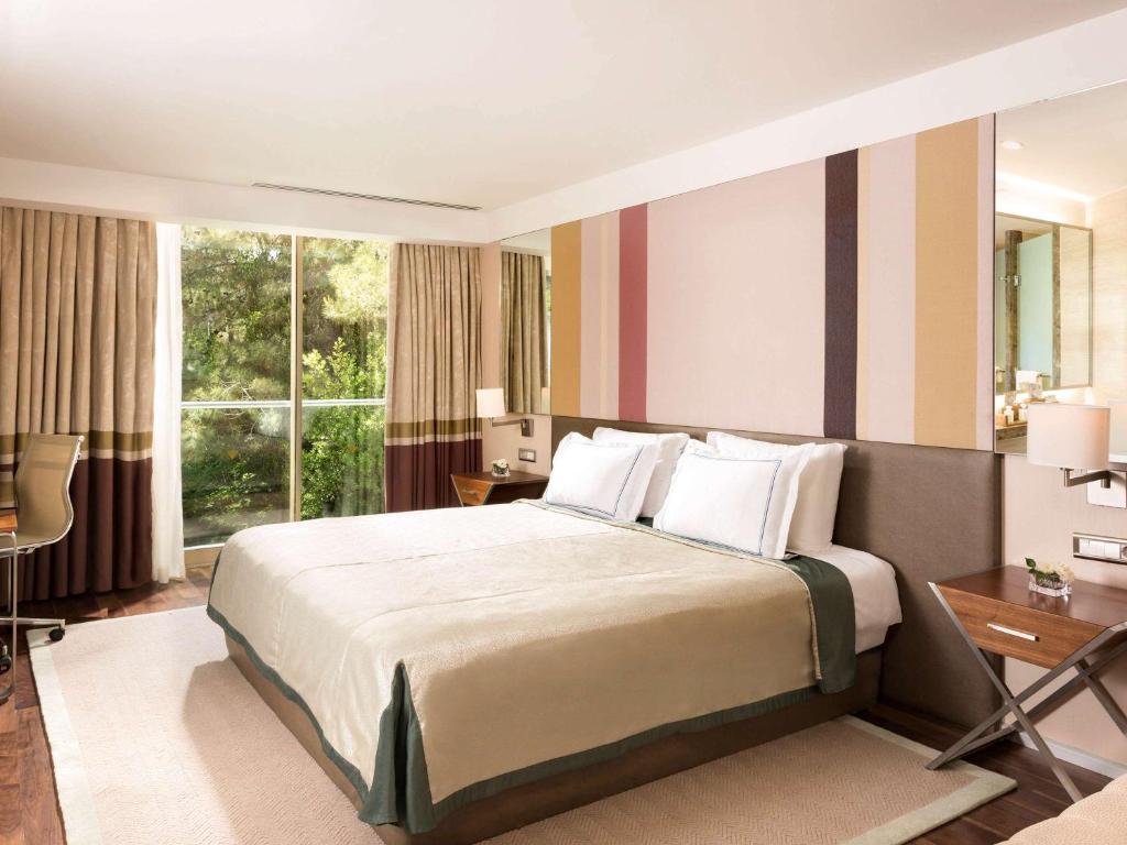 Mūsdienīgs numurs ar divguļamo gultu Rixos Premium Belek.