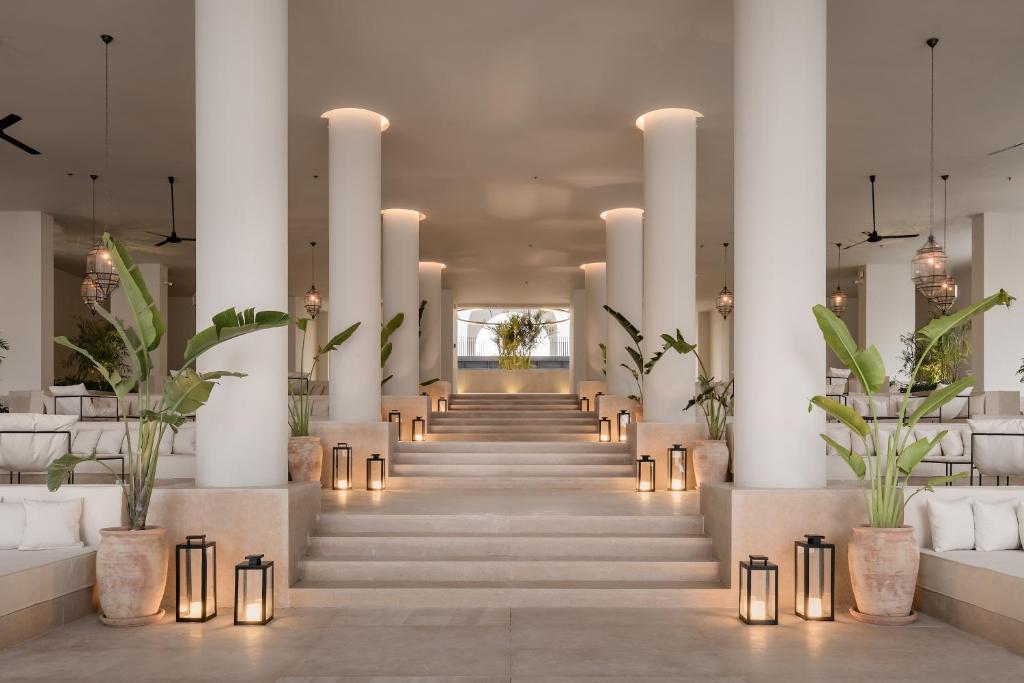 Elegant lobby of Serry Beach Resort with tall columns and warm lighting.
