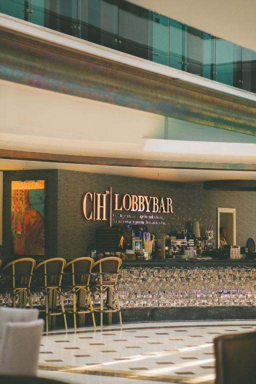 CIH Lobbybar pie Castival Hotel ar elegantiem krēsliem