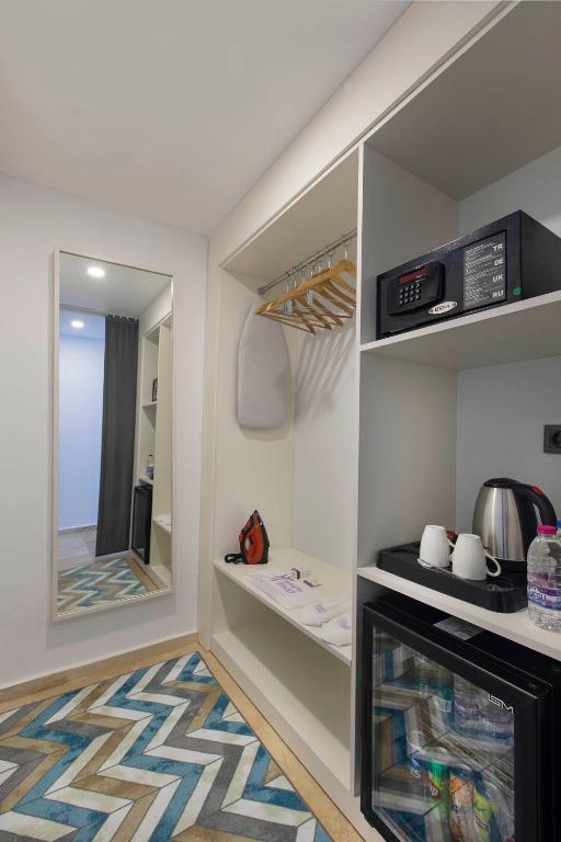 Numurs Holiday Inn Resort Bodrum ar skapi un ērtībām.