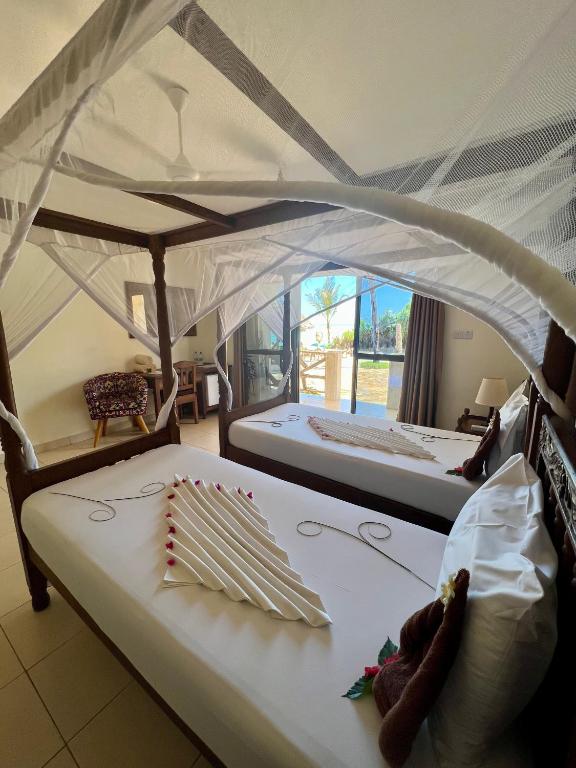 Numuri ar baldahīniem viesnīcā Mahali Zanzibar