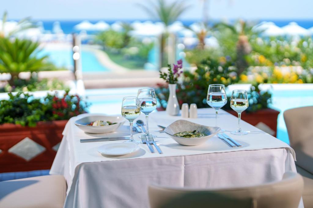 Elegant dining setup at Atrium Prestige Thalasso Spa Resort & Villas with sea view.
