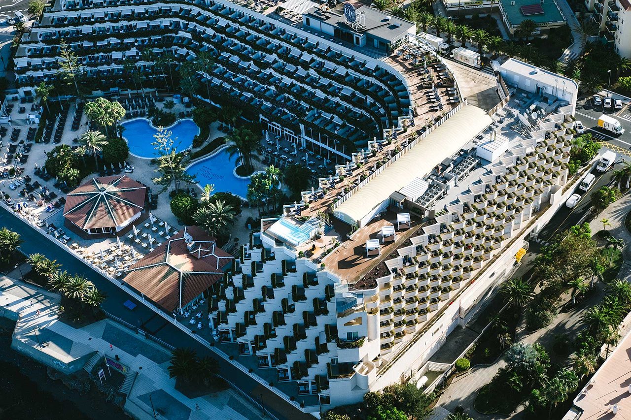Arona Gran Hotel & Spa aerial view with pools and terraces.