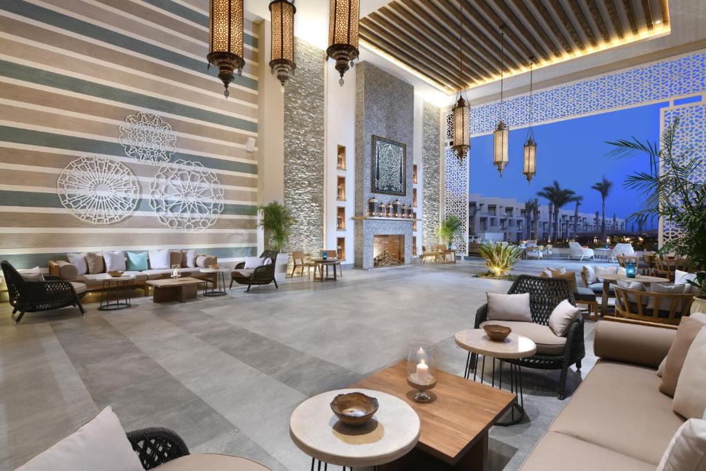 Elegant lobby at Steigenberger Resort Ras Soma with cozy seating.