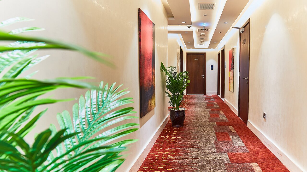 Rose Plaza Al Barsha elegant hotel corridor with modern decor