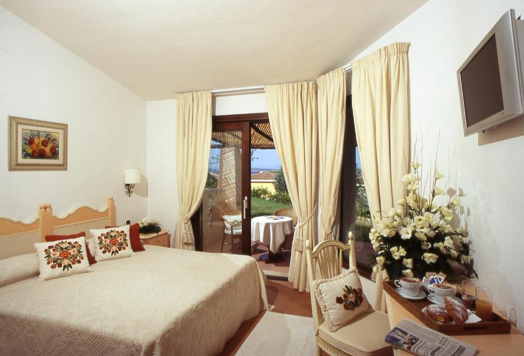 Hotel Stelle Marine numurs ar balkonu un skatu uz dārzu