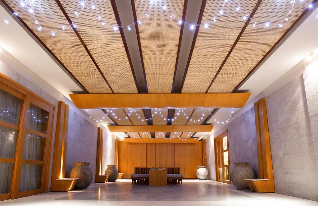 The Cliff Resort & Residences elegant lobby with warm lighting and decor.