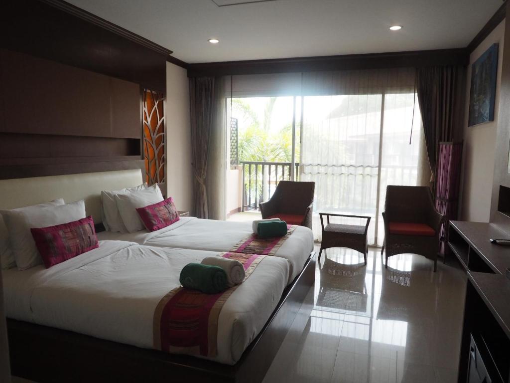 Moderns numurs ar divām gultām pie Chivatara Resort Bangtao