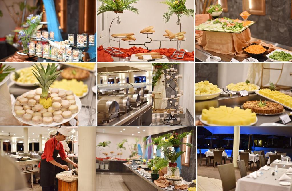 Bagātīgs bufetes galds ar dažādiem ēdieniem, augļiem un saldumiem, kas ir sakārtoti elegantā restorānā. Interjers ir moderns ar skaistiem dekoratīviem elementiem.