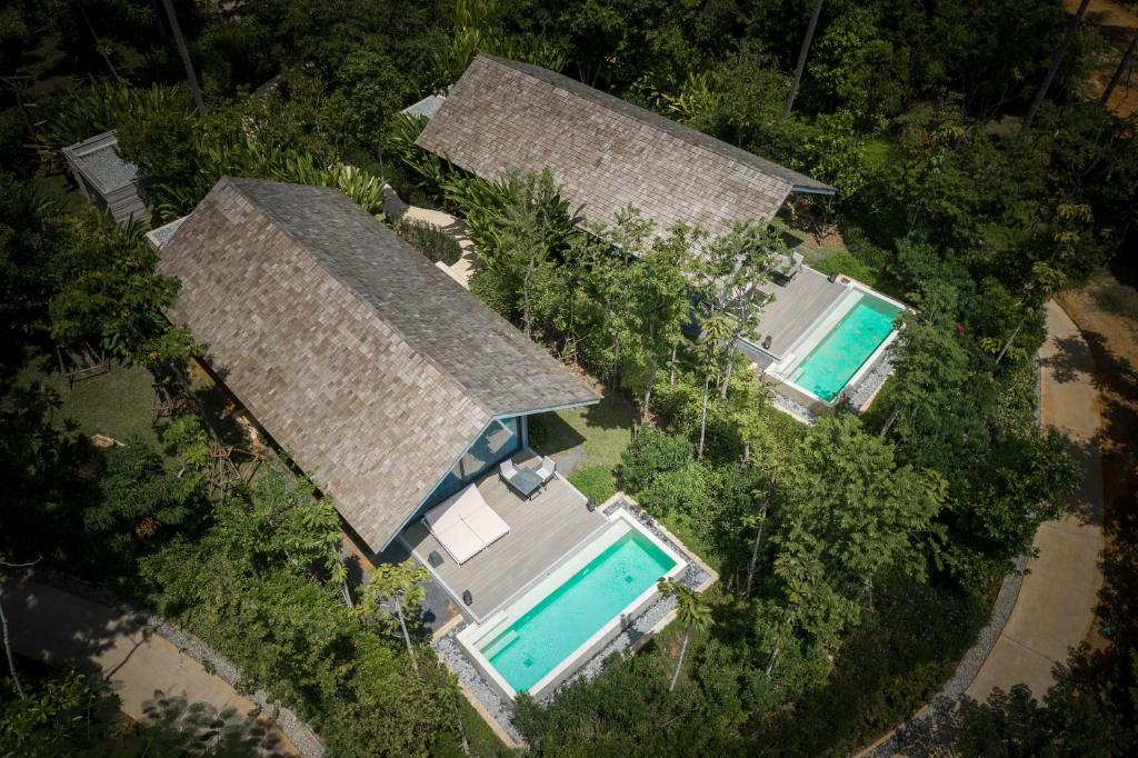 Aerial view of private villas with pools at Island Escape by Burasari.
