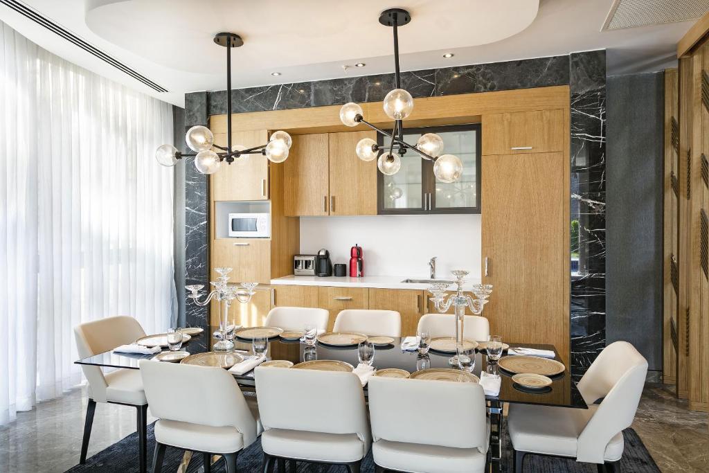 Elegant dining area with modern decor at Titanic Luxury Collection Bodrum