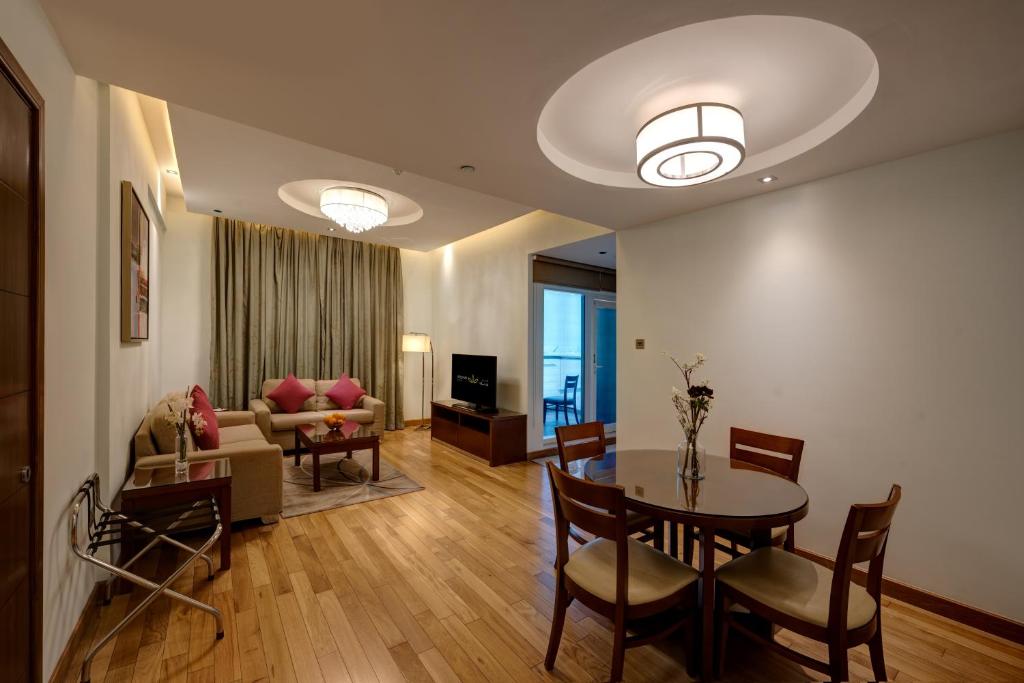 Elegant suite living area at Rose Park Hotel Al Barsha.