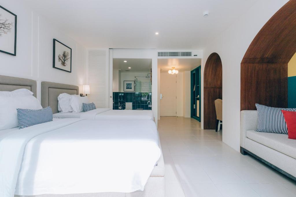 Moderns numurs viesnīcā Sugar Marina Nautical ar divām gultām un dīvānu