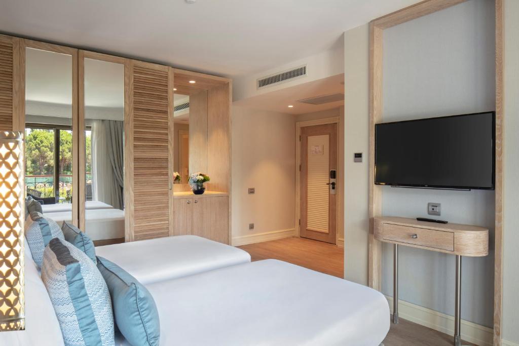Moderns numurs ar divām gultām hotelī Ela Excellence Resort Belek
