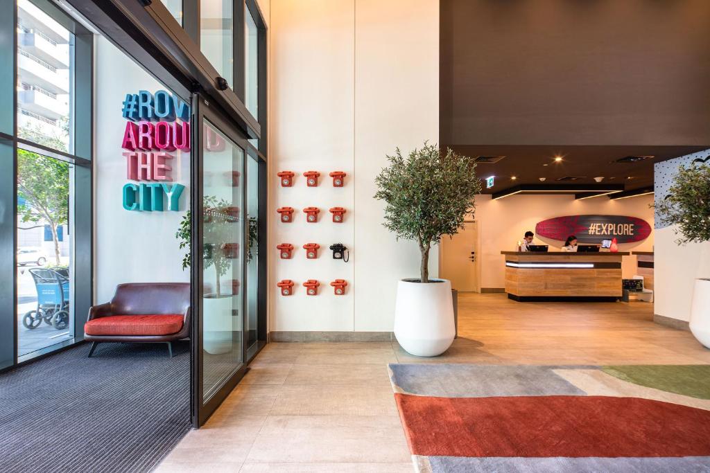 Rove Dubai Marina modern lobby with colorful decor.