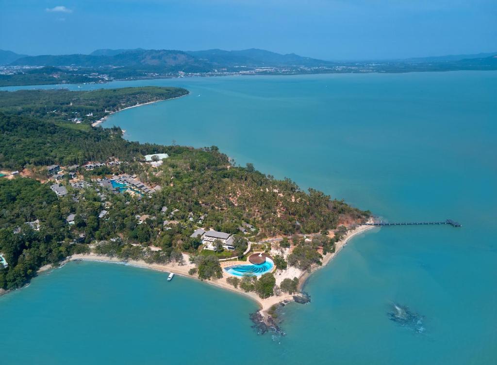 Aerial view of Island Escape by Burasari surrounded by clear turquoise waters