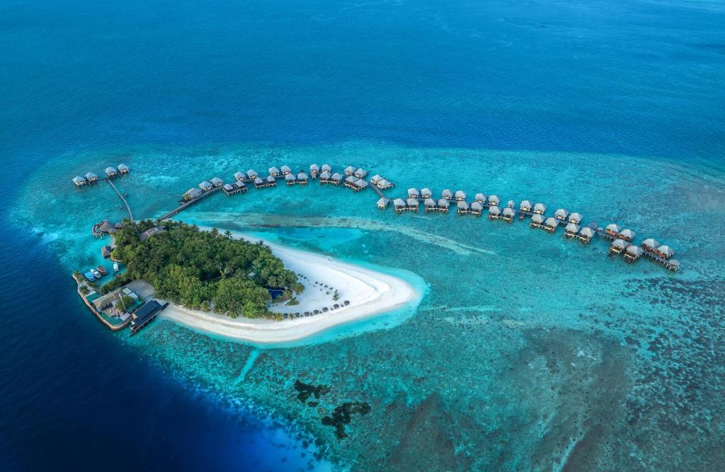 Tropu sala ar luksus viesnīcām uz ūdens, apkārtējiem koralliem un skaidru, zilu okeānu. Ideāla vieta atpūtai un relaksācijai.