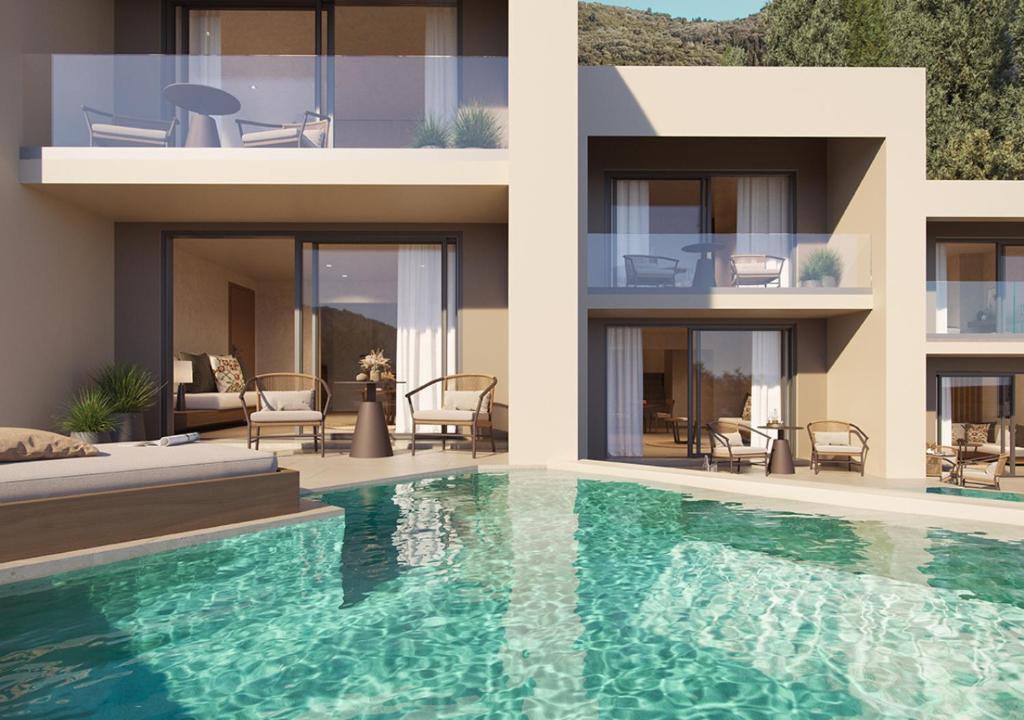 Mūsdienīga villa ar terasi un baseinu, kas atrodas gleznainā apkārtnē. Plašas stikla durvis un āra mēbeles nodrošina relaksējošu atmosfēru.