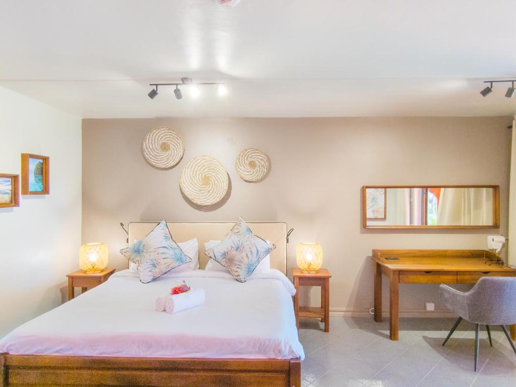 Numurs ar ērtu gultu viesnīcā Flowers of Paradise.